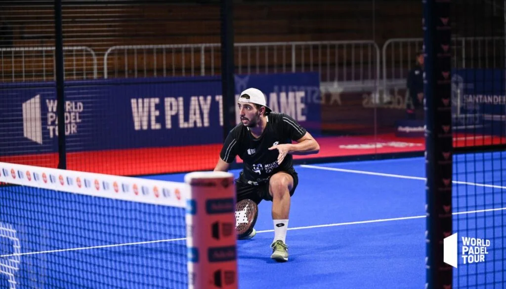 Professional padel player executing a bandeja during high-level tournament